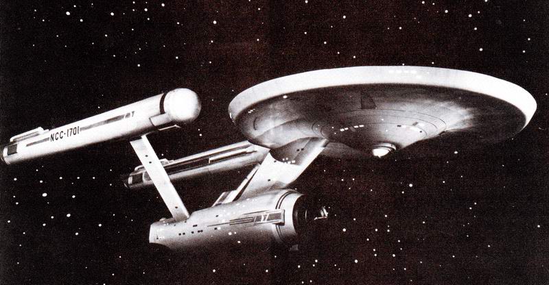 Black-and-white screenshot of the original Enterprise against a background of stars.